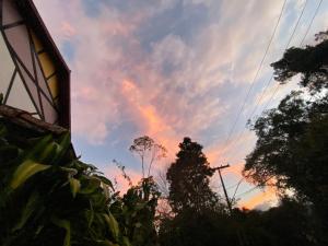 a rainbow in the sky at sunset at Hotel Philipp - Tradicional desde 1952 in Teresópolis +37 photos