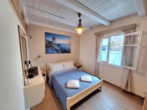 Postel nebo postele na pokoji v ubytování Captain Elias House