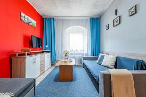 Televízia a/alebo spoločenská miestnosť v ubytovaní Apartmán u Petrů 1