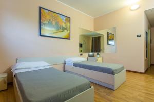 Postel nebo postele na pokoji v ubytování Break Hotel