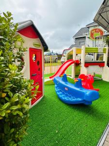 a playground with a toy car and a slide at Willa Saga in Władysławowo