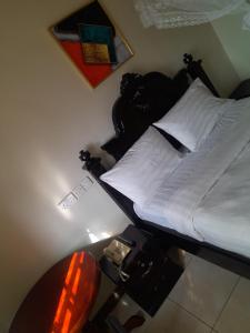 Postel nebo postele na pokoji v ubytování Harambee paradise hotel