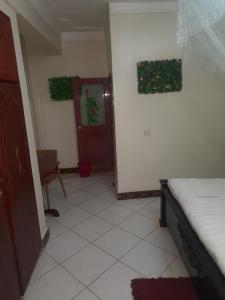 Postel nebo postele na pokoji v ubytování Harambee paradise hotel