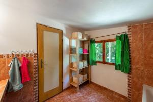a bathroom with a shower with green towels and a door at FOREST, lake, FIREFLIES, campfire - WHAT ELSE in Jindrichuv Hradec +30 photos