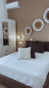 Ένα ή περισσότερα κρεβάτια σε δωμάτιο στο AMBELI Luxury Apartment