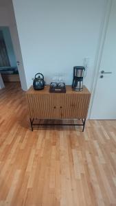 a coffee table with two appliances on top of it at Lühe-Blick-Waterfront in Jork