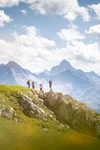 a group of people standing on top of a mountain at Hotel Pettneuerhof in Pettneu am Arlberg +154 photos