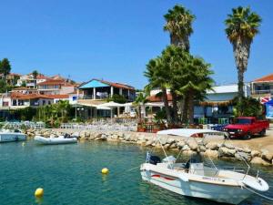 a group of boats in a body of water at 1-bedroom apartment in Finikounta