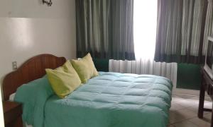 Łóżko lub łóżka w pokoju w obiekcie Hotel Marsal
