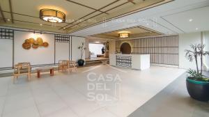a living room with a table and chairs in a room at Casa Del Sol Staycation in Manila +38 photos