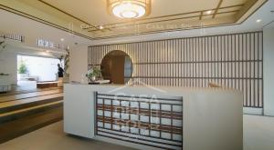 a lobby with a white counter in a building at Casa Del Sol Staycation in Manila