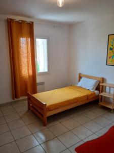 Ένα ή περισσότερα κρεβάτια σε δωμάτιο στο villa 3 chambres 5 mn de la plage