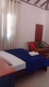 Postel nebo postele na pokoji v ubytování Thenu Homestay