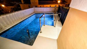 an overhead view of a swimming pool at night at Viña-Home in Torre del Mar +87 photos