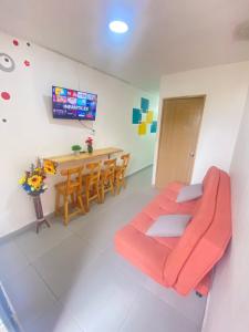 a living room with a couch and a table at 22 APARTAMENTO 3 habitaciones CON BALCON EN LAURELES ESTADIO in Medellín