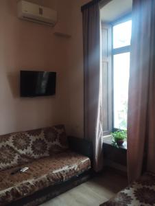 TV a/nebo společenská místnost v ubytování Anastasia studio + 5 fotografií