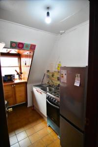 Kuchyň nebo kuchyňský kout v ubytování Central y acogedor con estacionamiento