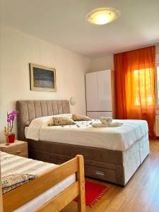 Postel nebo postele na pokoji v ubytování House Helena
