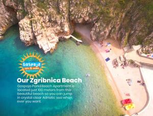 an aerial view of a beach with a rainbow at Gospoja Park & Beach Apartment Vrbnik in Vrbnik