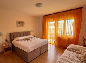 Postel nebo postele na pokoji v ubytování House Helena