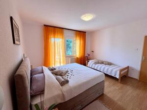 Postel nebo postele na pokoji v ubytování House Helena