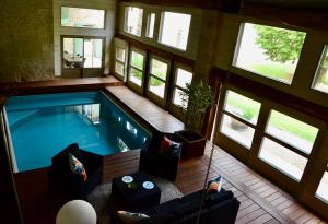 an overhead view of a swimming pool in a house at Maison de campagne avec piscine in Chambon