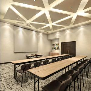a conference room with tables and chairs and a screen at Tru by Hilton Saltillo in Saltillo +38 photos
