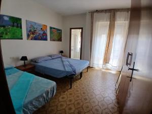 Ένα ή περισσότερα κρεβάτια σε δωμάτιο στο Birba Holiday Apartment