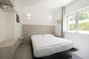 Posteľ alebo postele v izbe v ubytovaní Residenza Timpa Janca