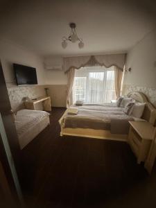Postel nebo postele na pokoji v ubytování Beauty Complex