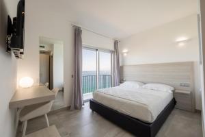 Posteľ alebo postele v izbe v ubytovaní Residenza Timpa Janca