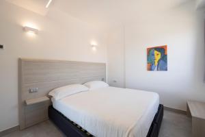 Posteľ alebo postele v izbe v ubytovaní Residenza Timpa Janca