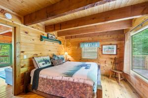 a bedroom with a bed in a log cabin at Pine Ridge in Sevierville