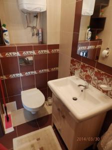 Ένα μπάνιο στο Apartament Żeglarz