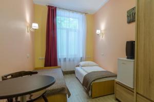 TV a/nebo společenská místnost v ubytování Gogol Park Rooms