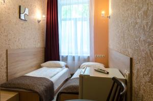 Postel nebo postele na pokoji v ubytování Gogol Park Rooms
