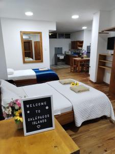 A bed or beds in a room at Hostal Darwin