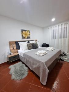 Ένα ή περισσότερα κρεβάτια σε δωμάτιο στο Madeira Inn Prazeres