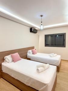 Ένα ή περισσότερα κρεβάτια σε δωμάτιο στο Menara Prestige Duplex 4BR with Pool Access