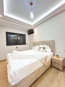 Ένα ή περισσότερα κρεβάτια σε δωμάτιο στο Menara Prestige Duplex 4BR with Pool Access