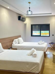 Ένα ή περισσότερα κρεβάτια σε δωμάτιο στο Menara Prestige Duplex 4BR with Pool Access
