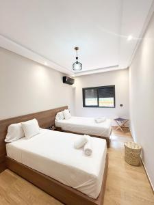 Ένα ή περισσότερα κρεβάτια σε δωμάτιο στο Menara Prestige Duplex 4BR with Pool Access +17 φωτογραφίες