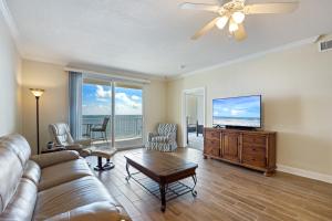a living room with a couch and a flat screen tv at Harbour Pointe 309 By Pkrm in Pensacola