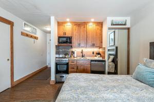 a kitchen with wooden cabinets and a stove top oven at 243 Bldg C condo in Truckee