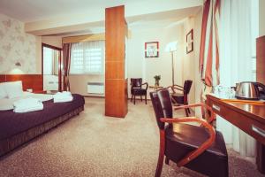 Postel nebo postele na pokoji v ubytování Hotel Vivaldi