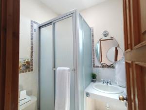 a bathroom with a sink and a mirror at Hotel Casa Blanca Inn in Estación Pamplona