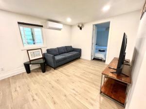 a living room with a couch and a television at remodeled 2b 1b house Rosemead c in Rosemead