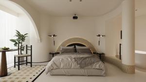 a bedroom with a large bed with a stone headboard at Town Designer B&B in Qingdao