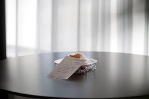 a piece of food sitting on top of a table at Town Designer B&B in Qingdao