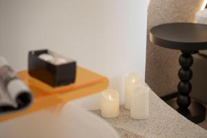 a group of candles sitting on a counter next to a table at Town Designer B&B in Qingdao
